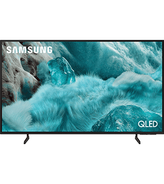 Televisão Samsung QLED com imagem de ondas do mar e pelúcia azul.